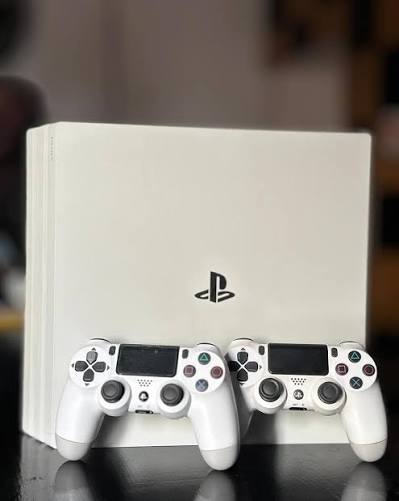 Renewed Sony PlayStation 4 Pro 1TB Console with 2 DUALSHOCK White Controllers